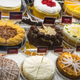 Cheesecakes on display in the fridge case at The Cheesecake Factory